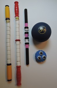 (left to right) the Marathon Stick, the Hybrid Stick, the RangeRoller Pro, the Orb Massage Ball, Addaday Marble Massage Roller