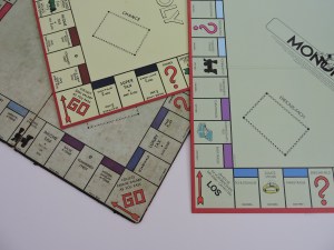 Monopoly game boards (L to R) - the original, UK edition, and German edition